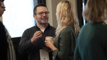 A picture of a man and woman drinking coffee