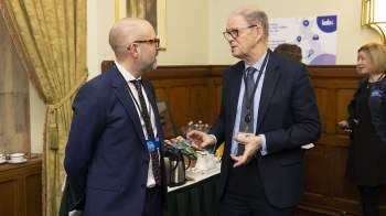 Two men engaged in conversation 