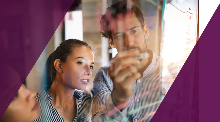 Two colleagues analyzing data while collaborating on media strategy