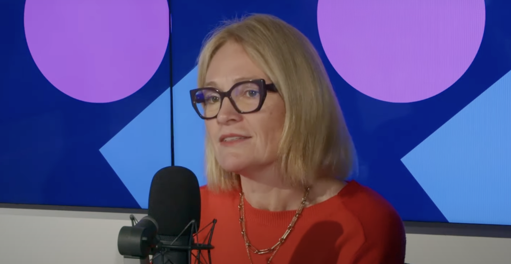 Woman speaking into microphone